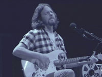 Pearl Jam Eddie Vedder ukulele songs tour in Portland 2011, photo by Daniel Temmesfeld, cc 2011